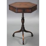 A 19th century style mahogany hexagonal drum-top occasional table, fitted three frieze drawers, on