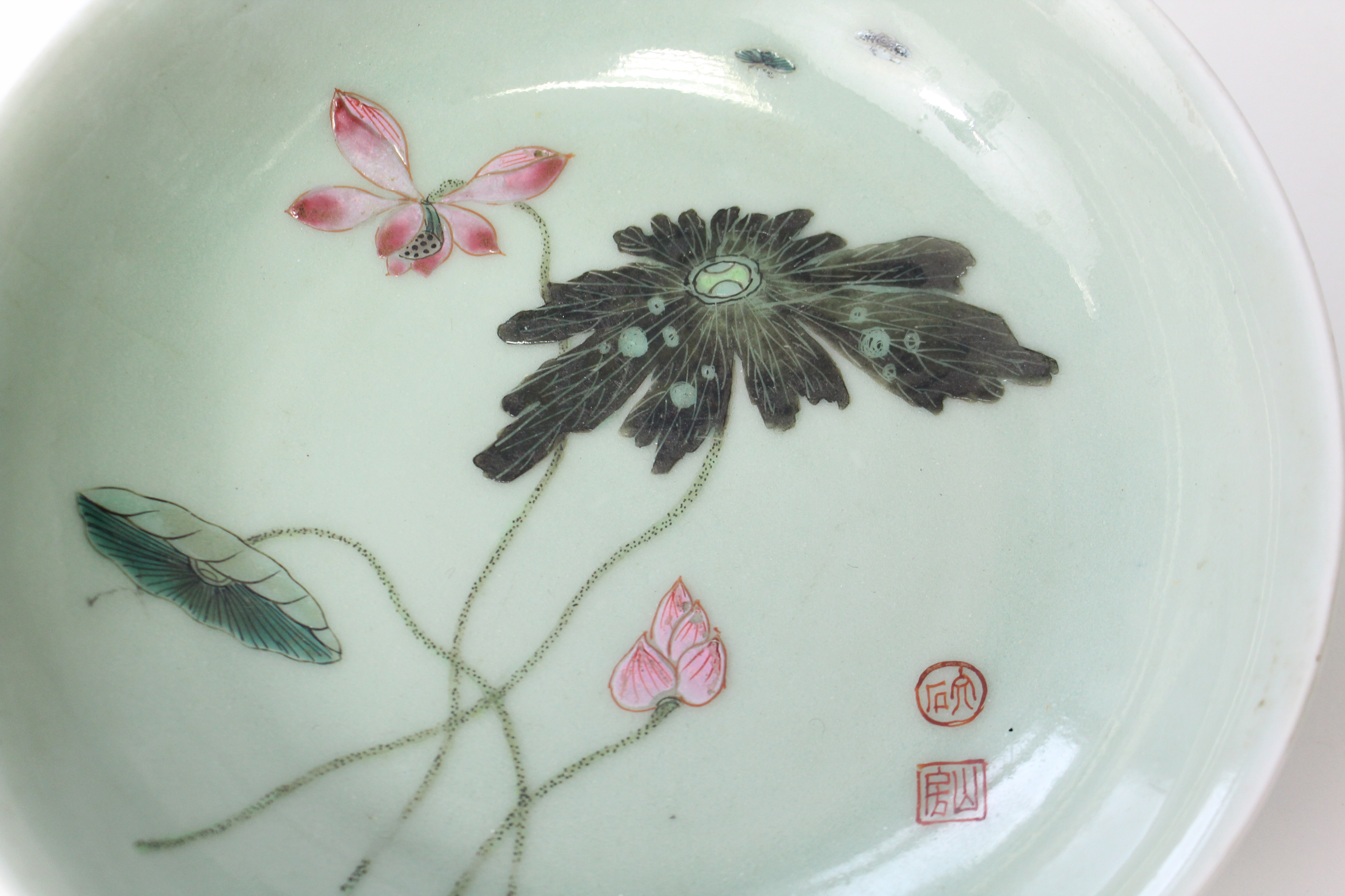 An 18th century Chinese porcelain saucer dish of celadon ground, painted with lotus flowers, leaves, - Image 5 of 7