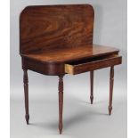 A regency mahogany tea table with ebonised string inlay, rounded corners to the rectangular top,