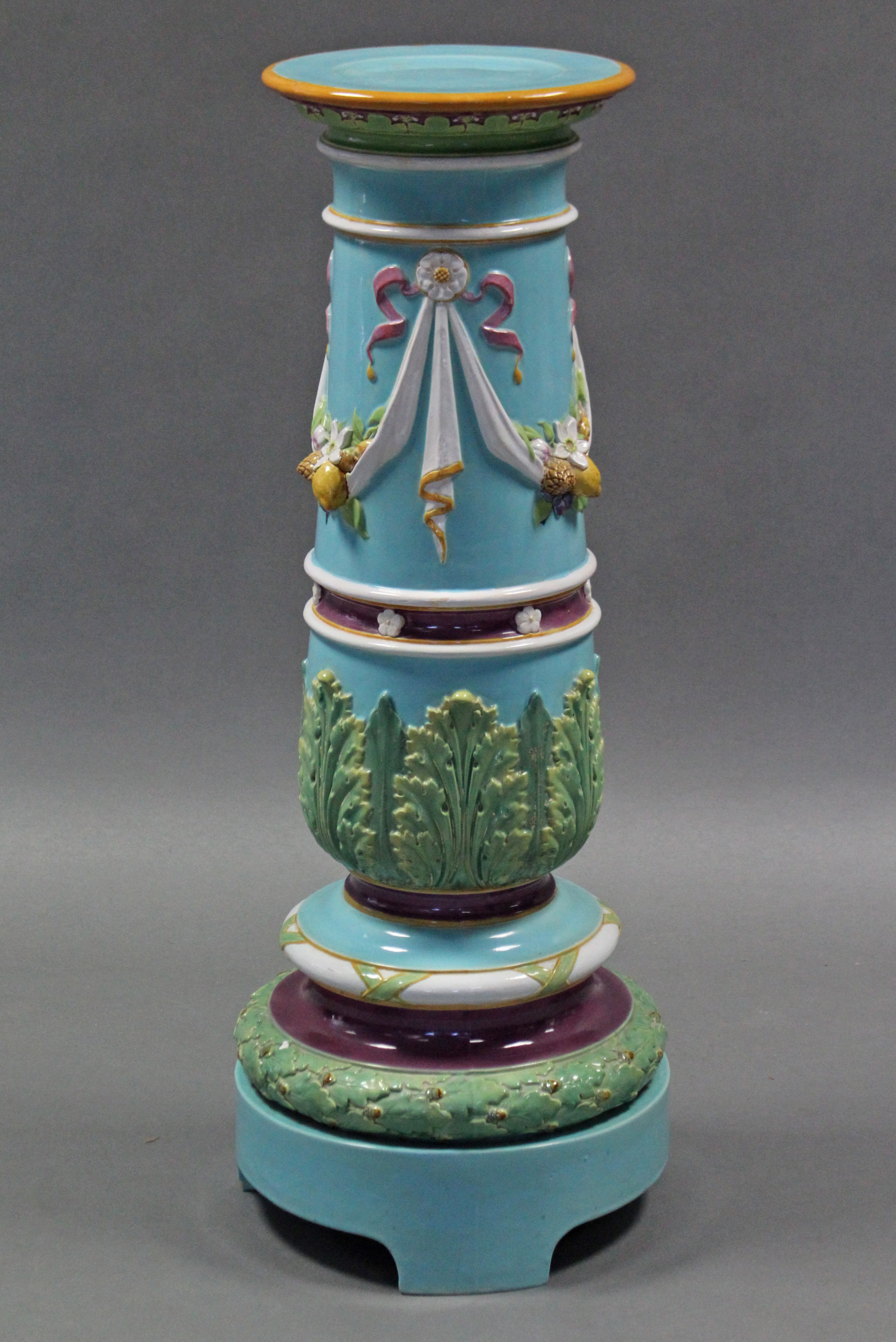 A 19th century MINTON MAJOLICA JARDINIERE STAND, of pale blue ground, the tapered cylindrical body