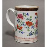 An 18th century Chinese porcelain large cylindrical tankard painted in bright famille rose enamels