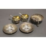 A Victorian silver scallop-shell dish on three dolphin supports, 3” wide, London 1867 by Henry