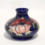 A Moorcroft “Anemone” squat round vase with short narrow neck, painted initials & impressed marks;