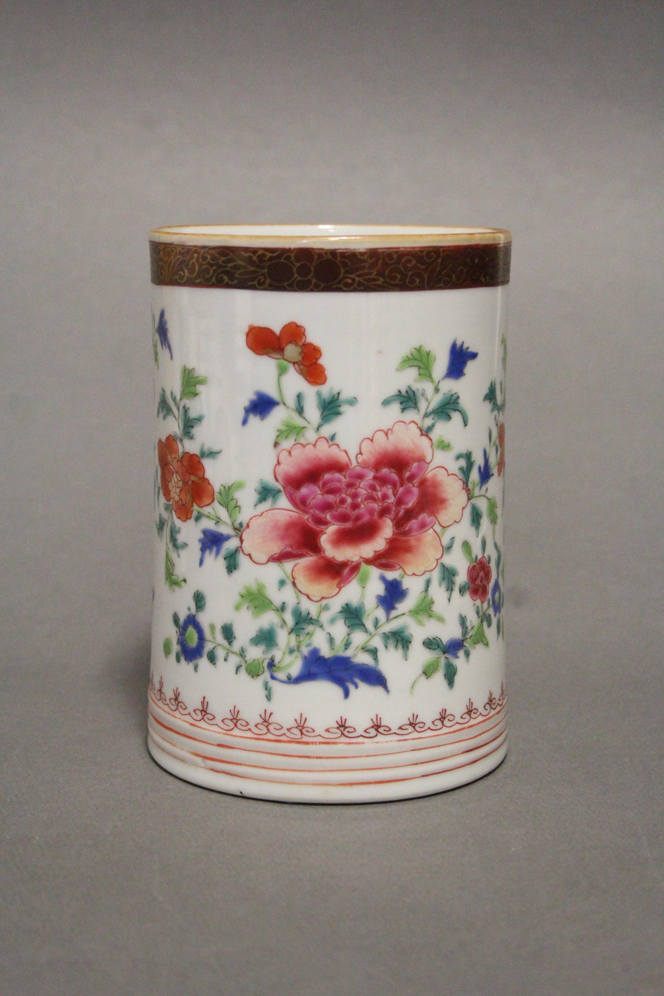 An 18th century Chinese porcelain large cylindrical tankard painted in bright famille rose enamels - Image 2 of 5