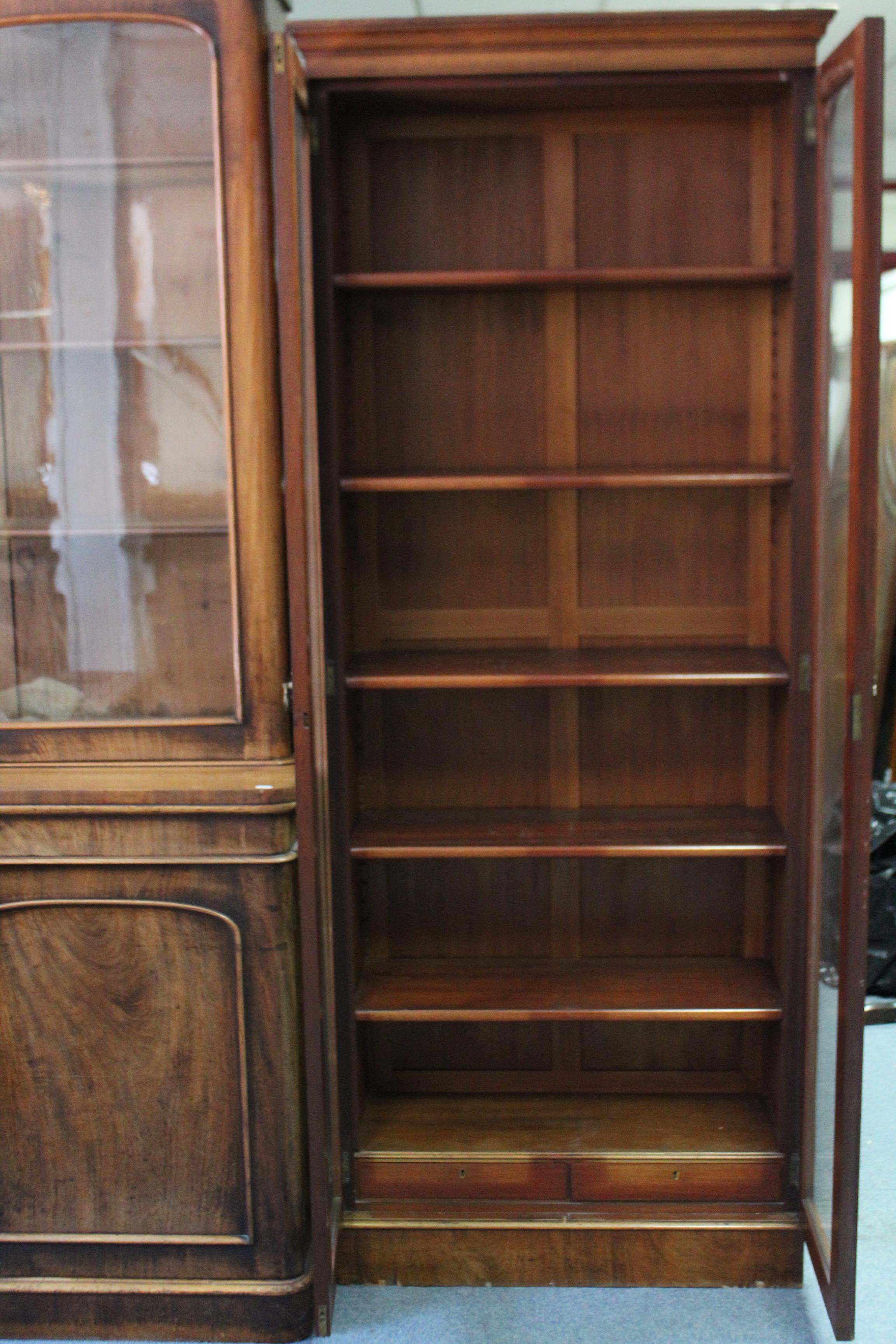 A late Victorian tall standing mahogany bookcase, fitted five adjustable shelves above two short - Image 2 of 3