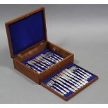Twelve pairs of late Victorian engraved fish knives & forks, in fitted oak case.