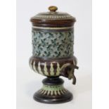 A Doulton Lambeth stoneware water filter, the cylindrical body with removable lid & relief