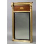 A regency giltwood pier glass, the mirror plate with ebonised reeded inner slip below an inlaid-