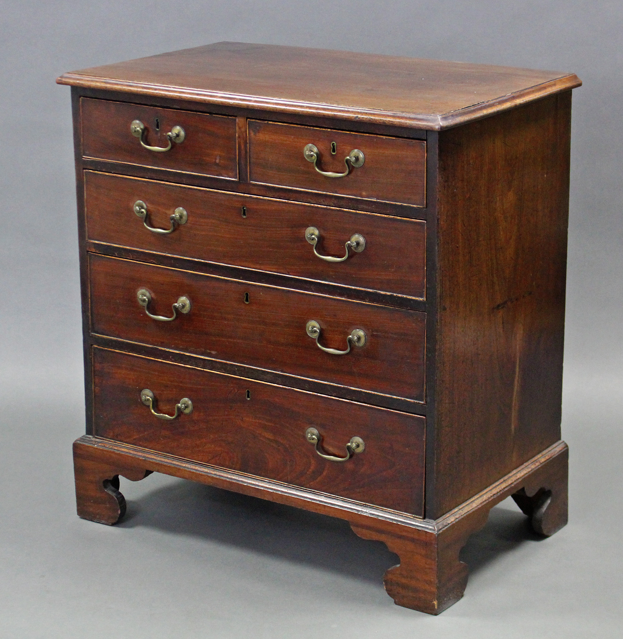 A George III mahogany chest, with moulded edge, fitted two short & three long graduated oak lined