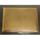 A 9ct. gold engine-turned rectangular pocket cigarette case, 4¼” x 3¼”; Birmingham hallmarks for