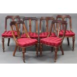 A set of six William IV mahogany Athenian style dining chairs with carved splat to the shaped backs,