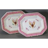 A pair of copies of 18th century armorial rectangular meat plates with canted corners, decorated