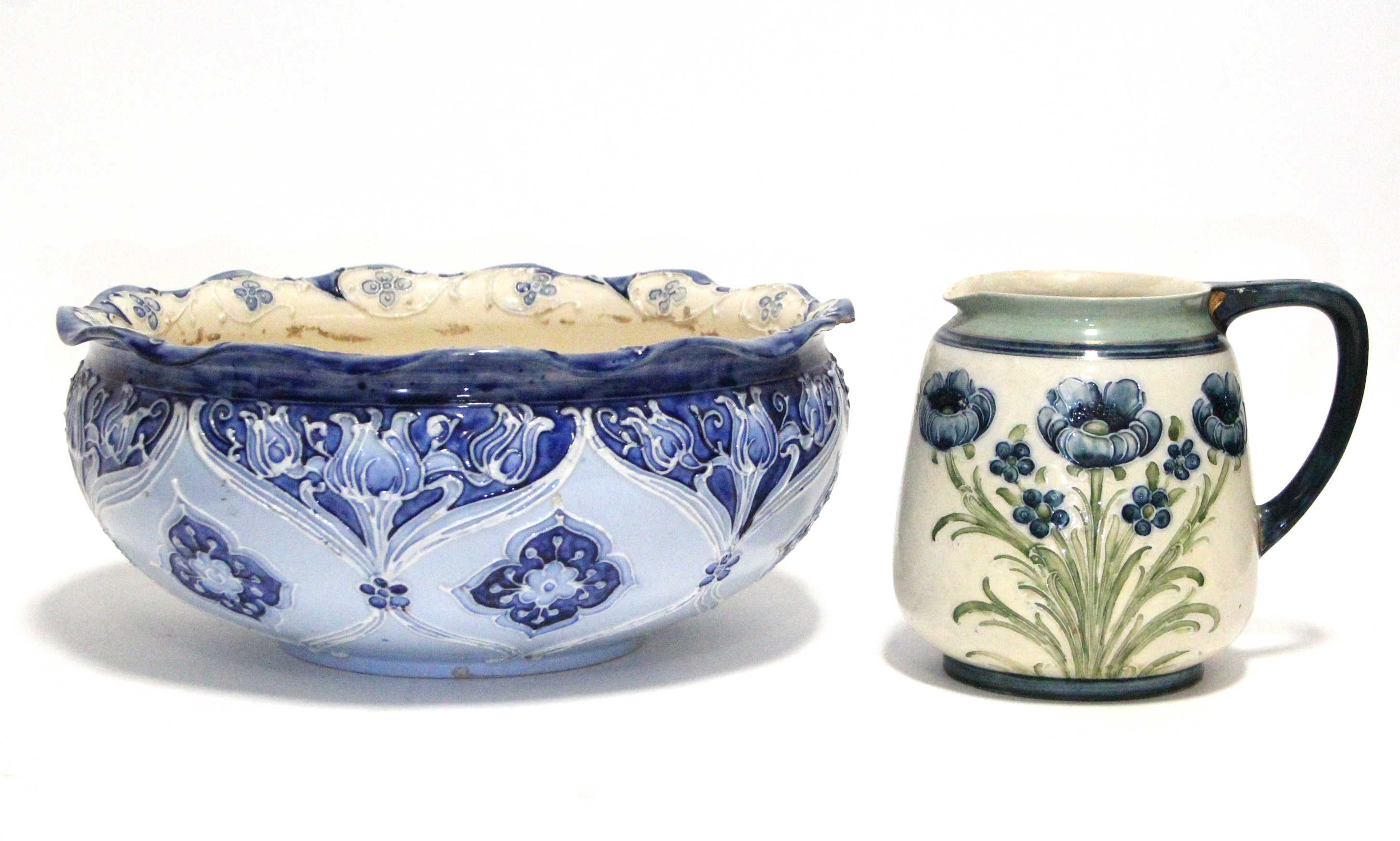 A MacIntyre Florian Ware circular shallow bowl decorated in shades of blue with stylised tulips,