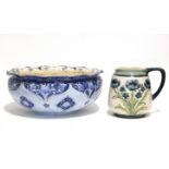 A MacIntyre Florian Ware circular shallow bowl decorated in shades of blue with stylised tulips,