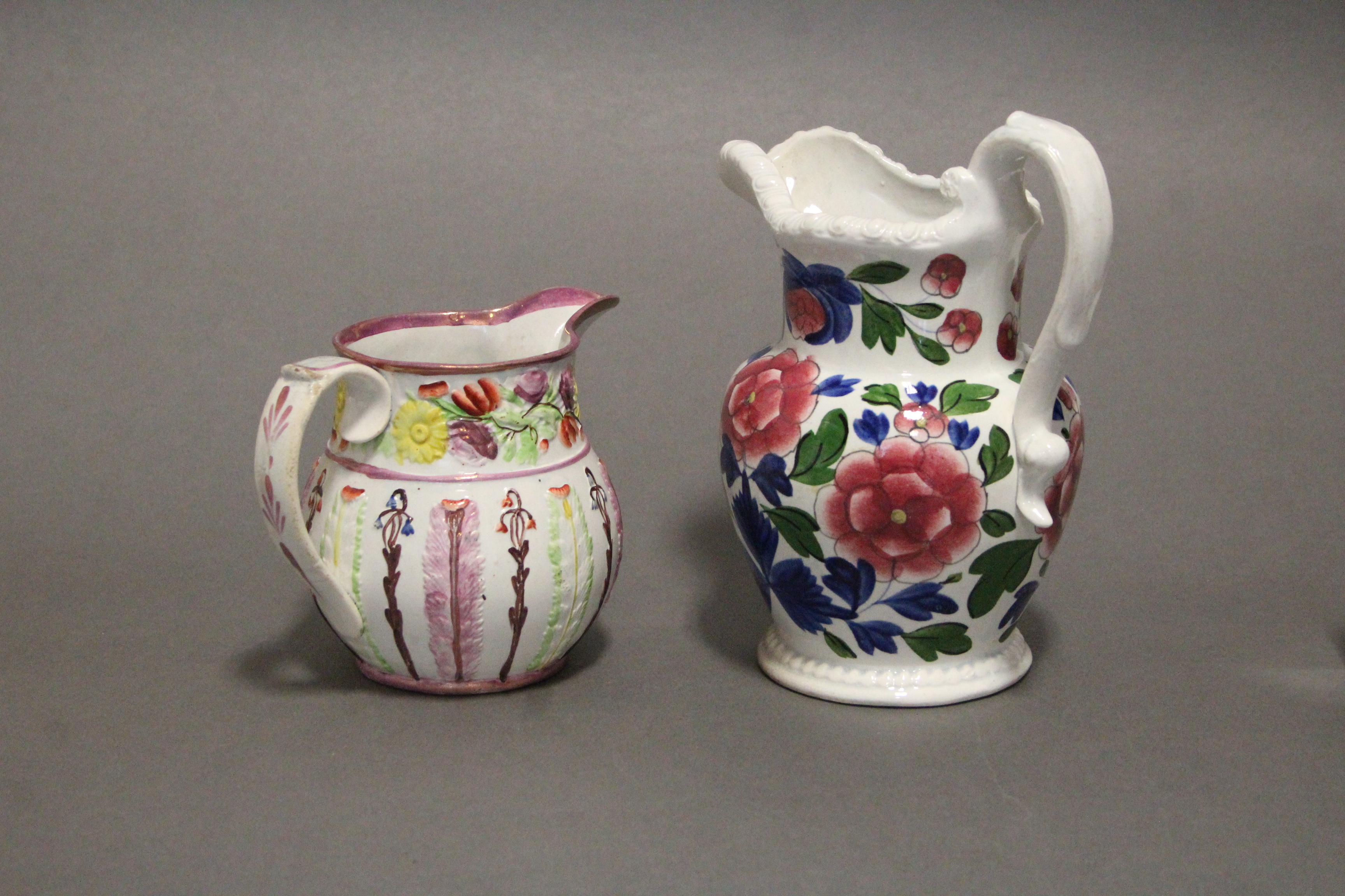 An early 19th century Swansea pottery bulbous jug with gadrooned rim, & with floral decoration in - Image 2 of 4