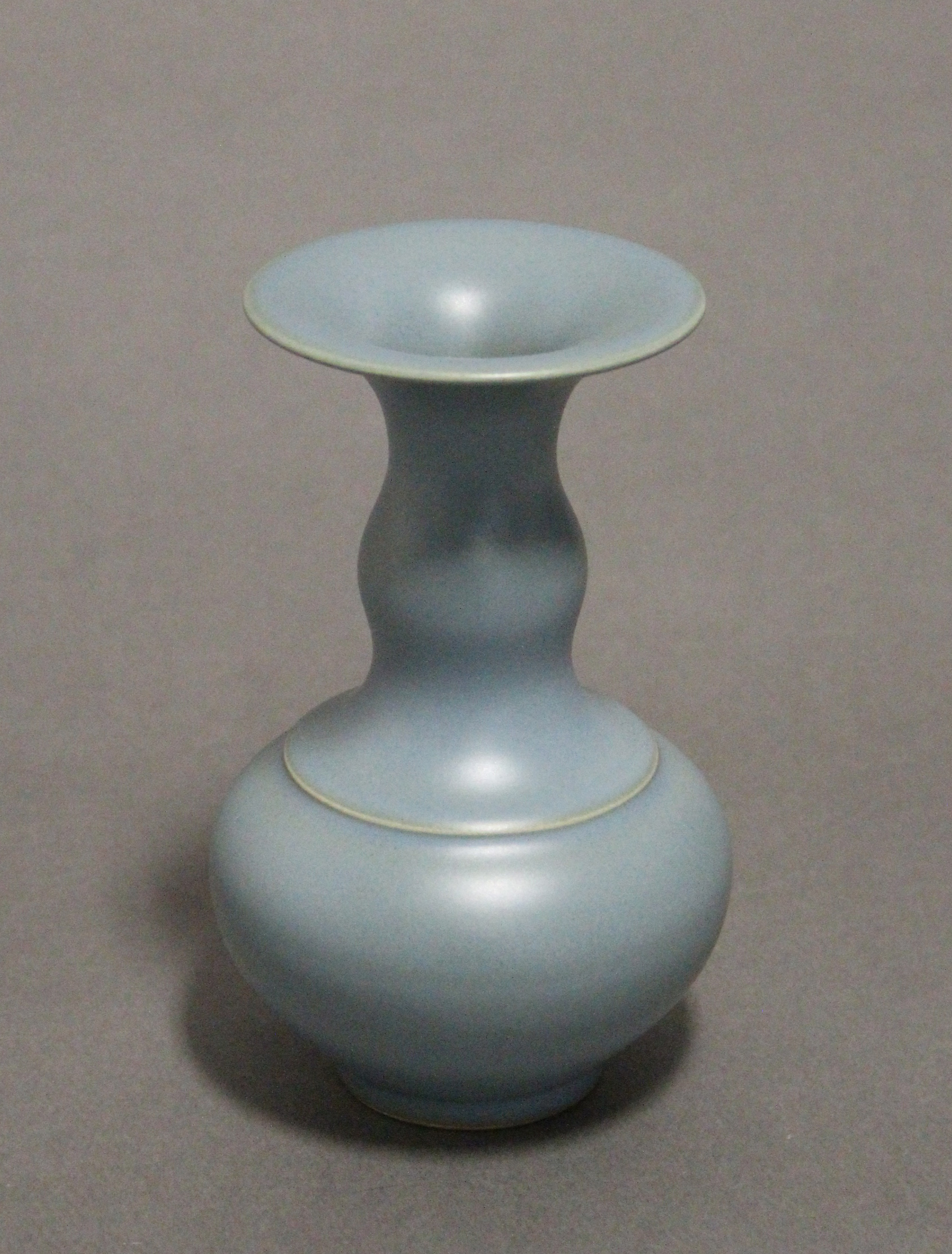 A Chinese pale blue glazed porcelain squat round vase with wide flat rim to the narrow neck, bears - Image 2 of 5