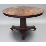 A late regency rosewood loo table, the circular tilt-top on hexagonal centre column & triform base