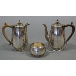 A pair of modern silver café-au-lait jugs of plain ovoid form, with boxwood scroll handles &