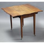 A George III mahogany Pembroke table of serpentine outline, the crossbanded top with canted corners,