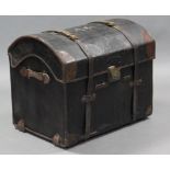 A 19th century dome-top leather travelling trunk, the hinged lid inscribed “A. P”, enclosing a
