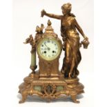 A 19th century French mantel clock in gilt speltre & onyx figured case, the 3¼” white enamel dial