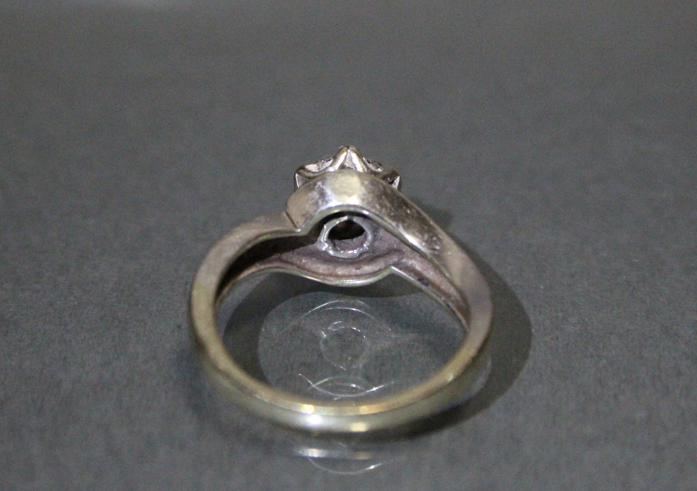 A diamond cluster ring set seven small stones, a row of five further stones to each curved shoulder, - Image 3 of 3