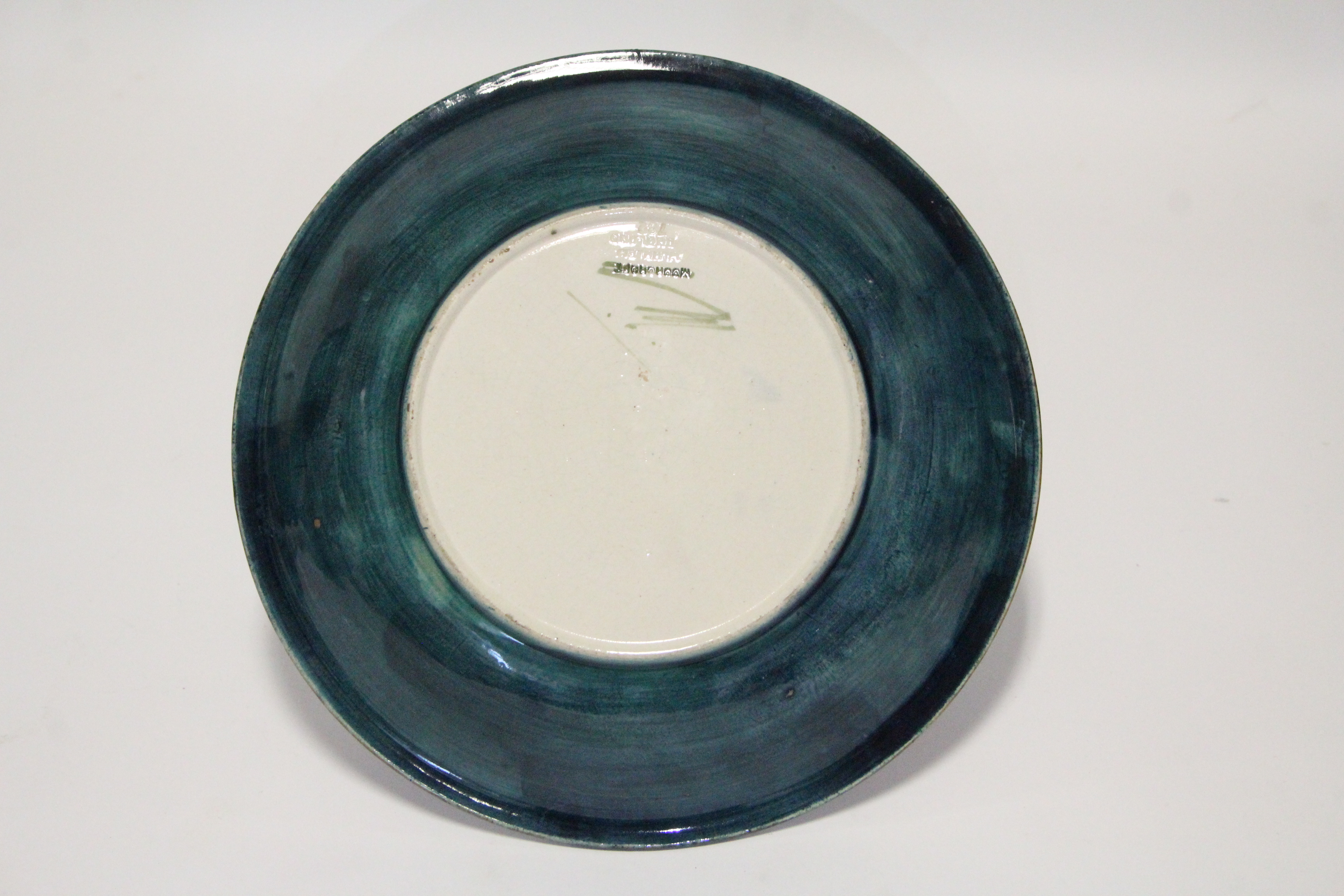 A Moorcroft “Pomegranate” circular shallow dish of mottled blue/green ground, painted initials & - Image 2 of 2