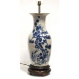 A Chinese “crackleware” cream-ground baluster vase with flared rim & underglaze blue decoration of