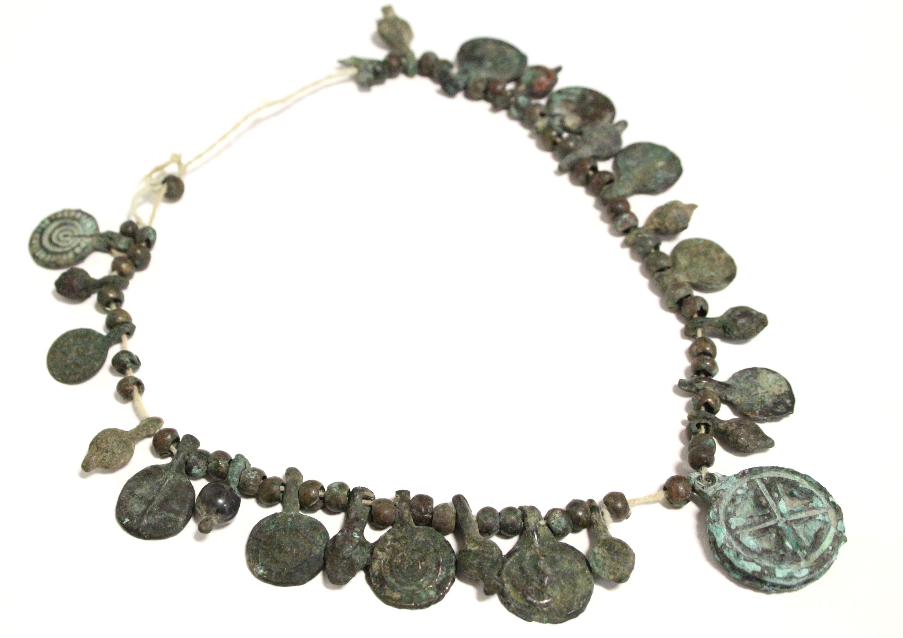 A Byzantine bronze necklace of decorated flat circular panels with small plain beads in between. - Image 2 of 3