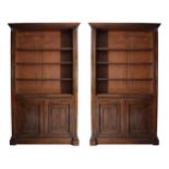 A PAIR OF GEORGE IV CARVED MAHOGANY TALL OPEN LIBRARY BOOKCASES, each fitted three adjustable