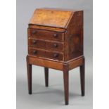 A late 18th century continental inlaid mahogany small bureau with sloping fall-front enclosing eight