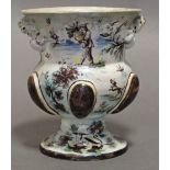 A 17th/18th century continental faience urn-shaped vase with polychrome decoration of figure scenes,