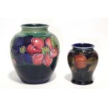 A Moorcroft “Anemone” ovoid vase with short neck, blue/green ground, painted initials & impressed