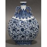 A Chinese blue-&-white porcelain pilgrim flask painted with a scrolling floral design in the Ming