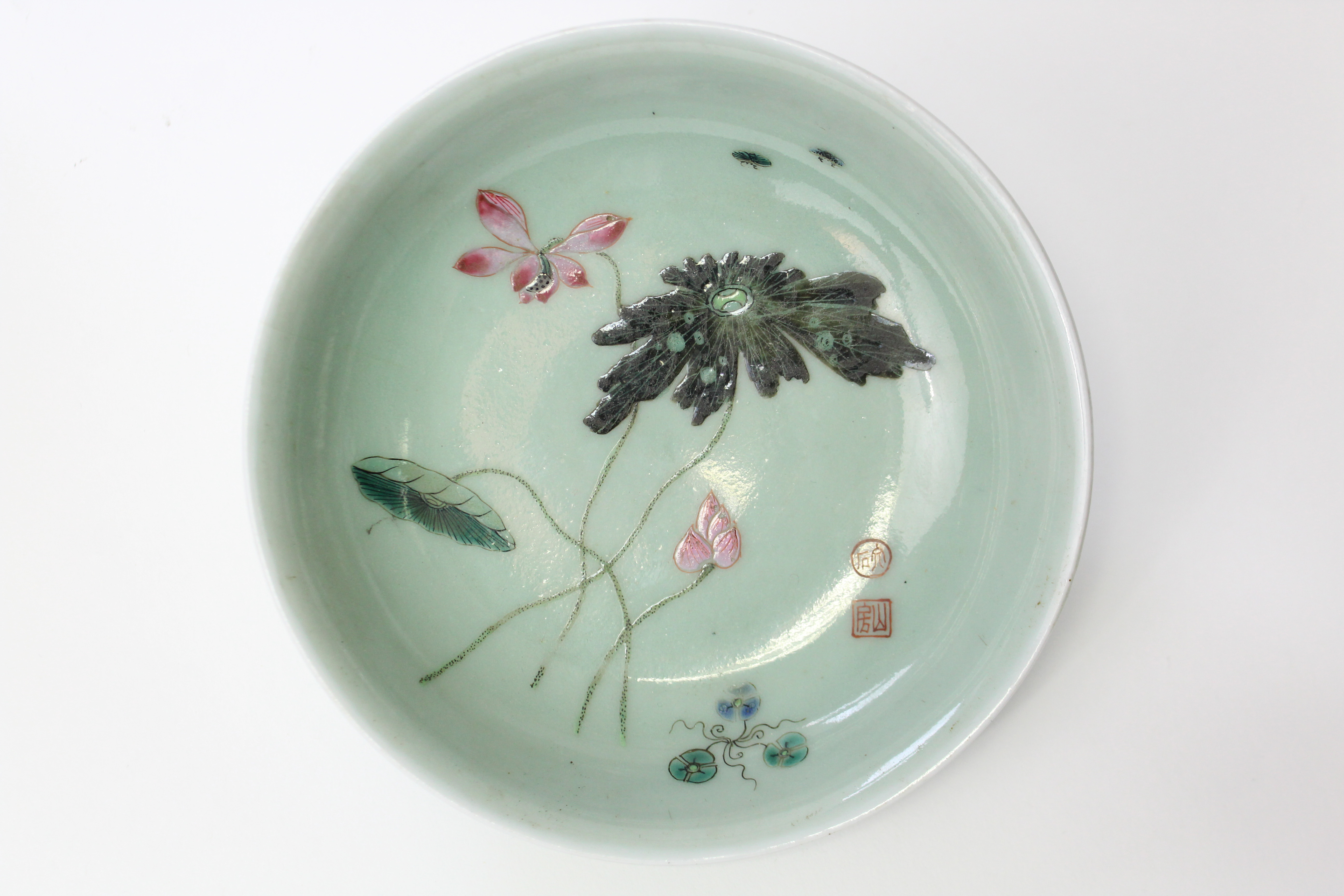 An 18th century Chinese porcelain saucer dish of celadon ground, painted with lotus flowers, leaves, - Image 4 of 7