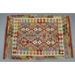 A Choli Kelim rug of multi-coloured geometric design; 4’3” x 3'.