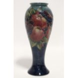 A modern Moorcroft “Finches & Fruit” tall slender ovoid vase of blue/green ground; 10½” high. (