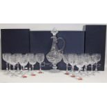 A set of eighteen French cut glass large wine goblets, 7” high; & a matching tall claret jug with “
