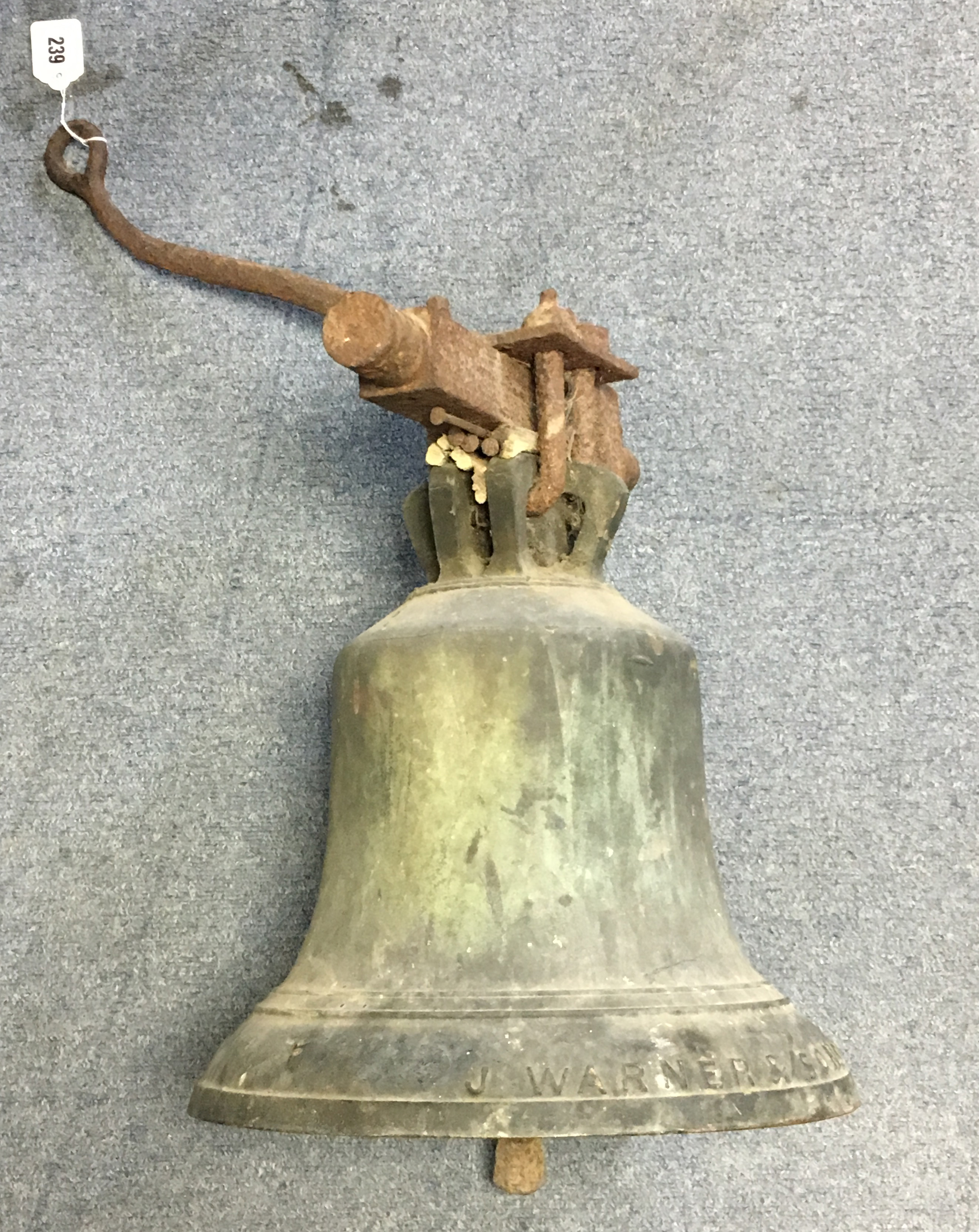 A 19th century BRONZE BELL cast by I WARNER & SONS, LONDON, dated 1873; with original clapper & iron