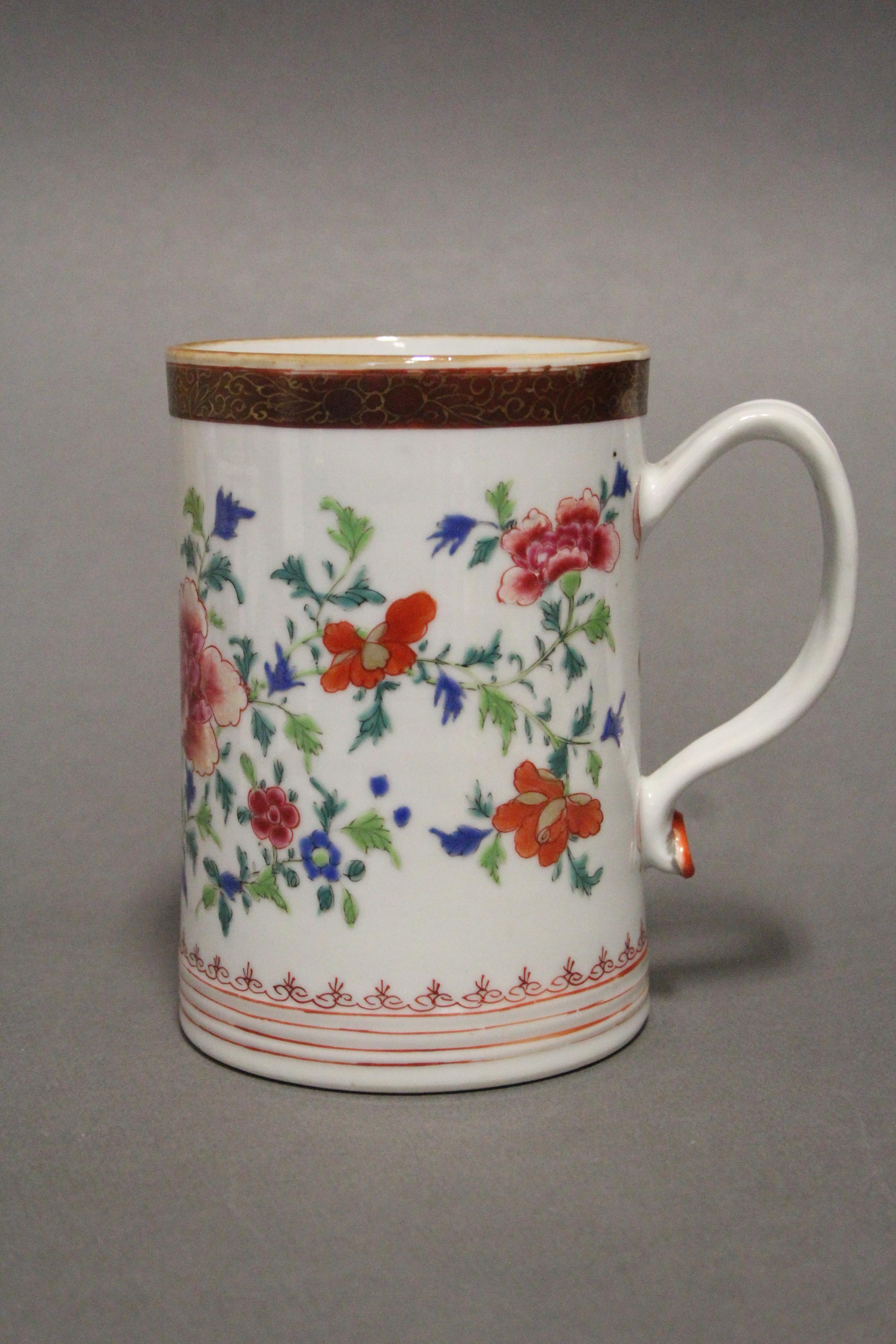 An 18th century Chinese porcelain large cylindrical tankard painted in bright famille rose enamels - Image 3 of 5