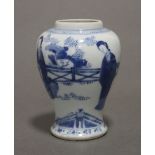 A Chinese Kangxi period blue & white porcelain small baluster vase painted with ladies in a formal