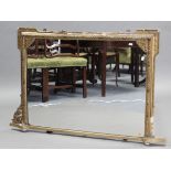 A regency overmantel mirror in carved giltwood & gesso frame with foliate borders & beaded edge; 31”