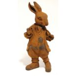 A cast iron model of Benjamin Bunny standing with pipe in one hand, 18” high.