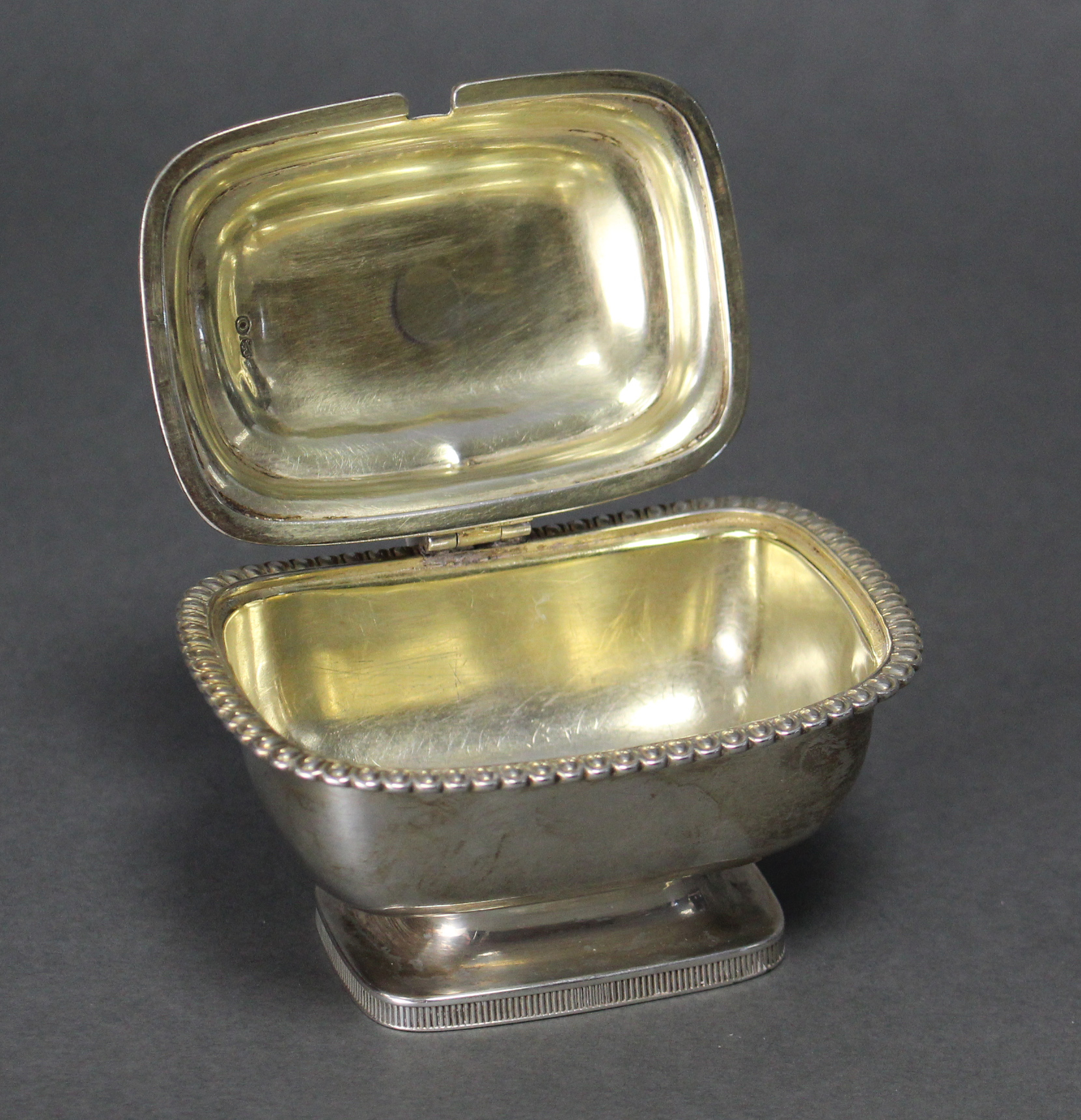 A George III silver mustard pot of compressed rectangular form, with gadrooned rim, ball finial to - Image 2 of 3