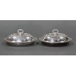 A pair of small oval entrée dishes with gadrooned rims, & detachable ring handles; 8” x 5½”.