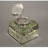 An early 20th century silver-mounted heavy square glass inkwell with canted edges & hobnail base,