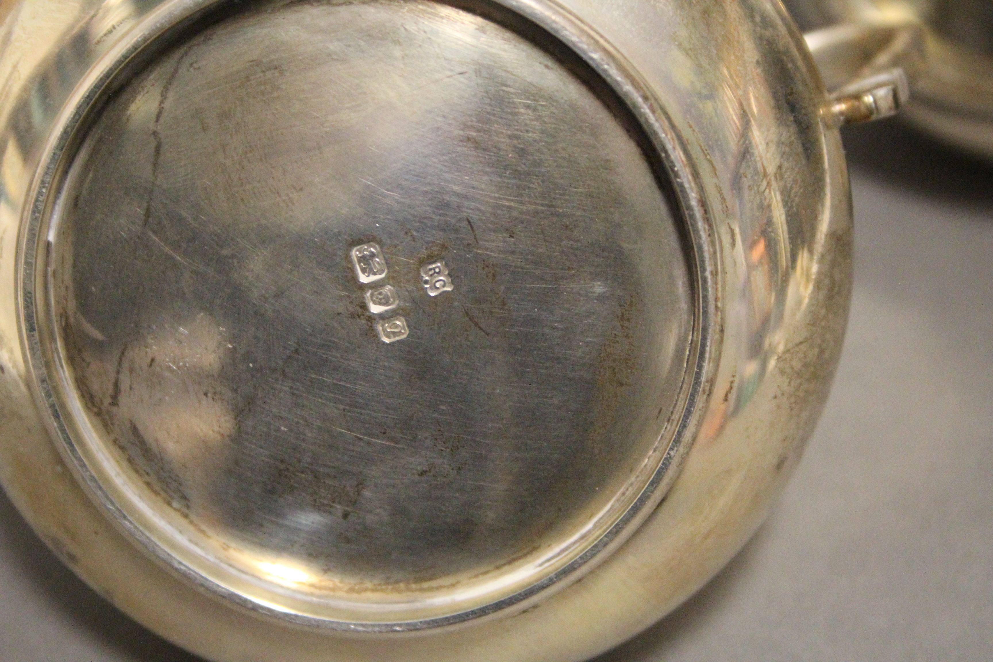 A George V heavy-gauge silver milk jug in the early 18th century style, of squat baluster form - Image 3 of 3