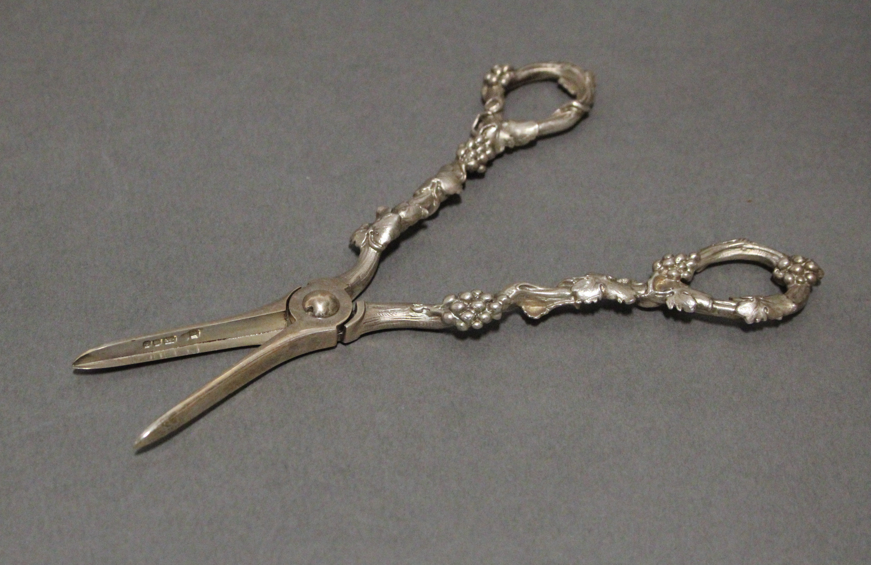 A pair of modern silver grape scissors with cast grapevine handles; London 1978. - Image 2 of 2