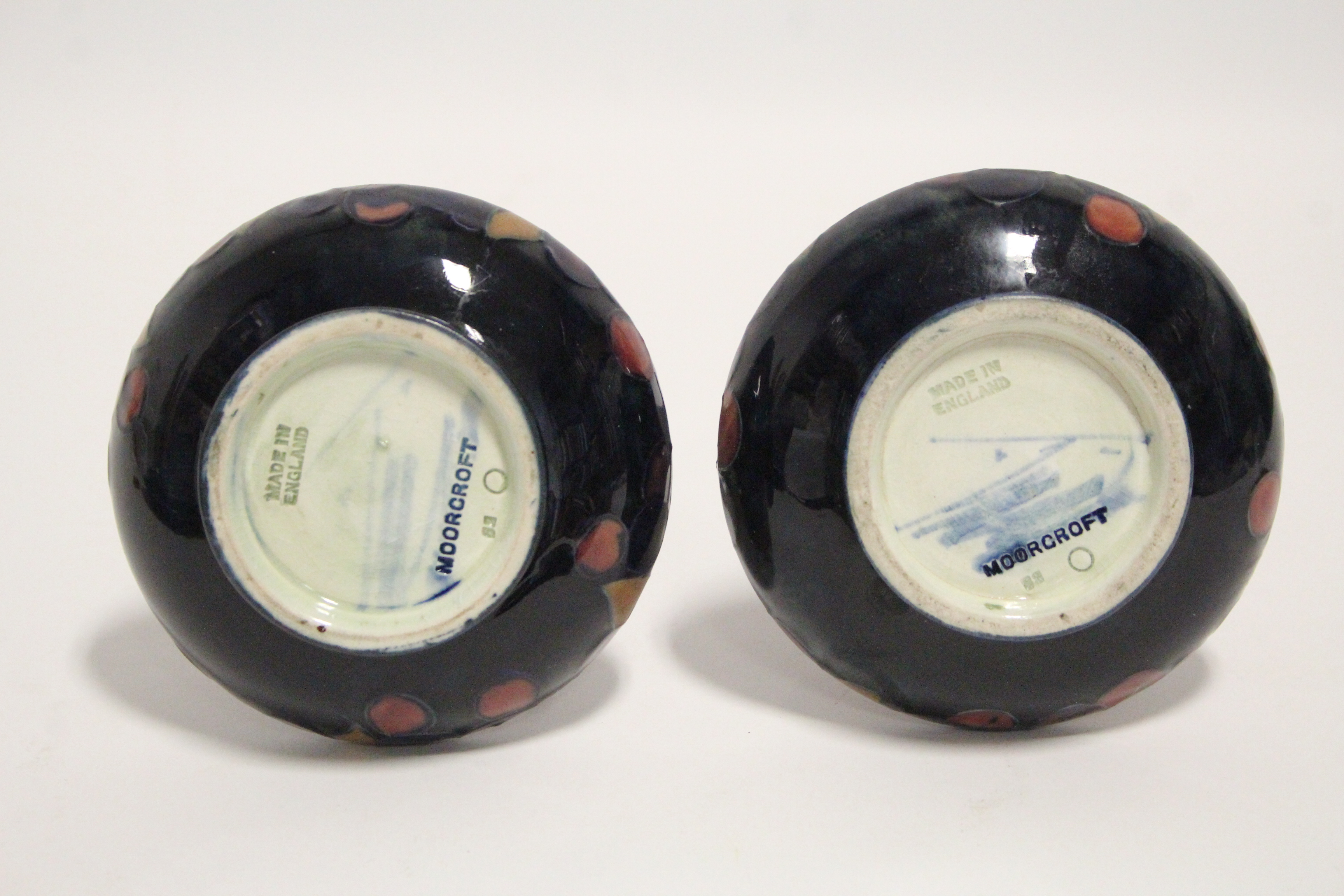 A pair of Moorcroft “Pomegranate” pattern squat round vases with tall narrow necks, blue painted - Image 2 of 2