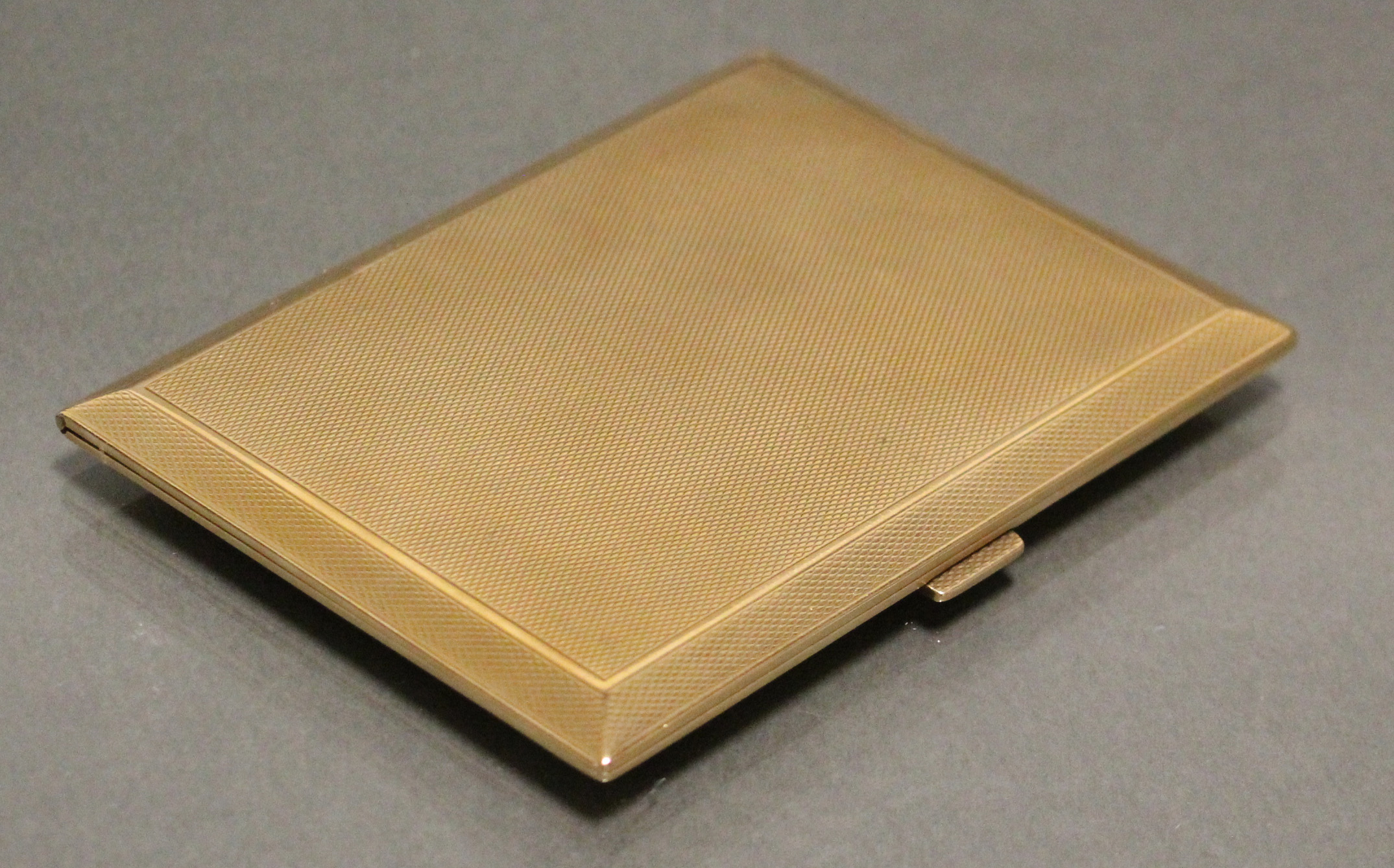 A 9ct. gold engine-turned rectangular pocket cigarette case, 4¼” x 3¼”; Birmingham hallmarks for - Image 4 of 4